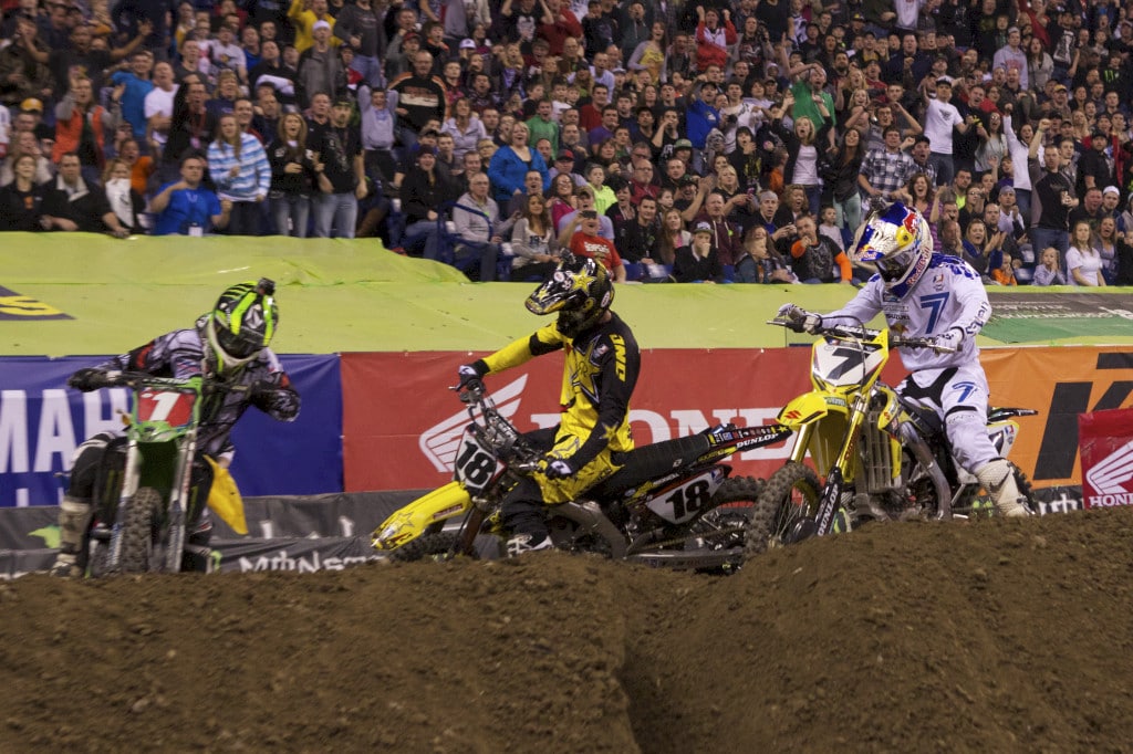 Being unable to get his bike going in time, Stewart's lead slipped away as Villopoto, Millsaps, and Dungey pass him on the off-camber turn. Villopoto was now where he needed to be for all important championship points.